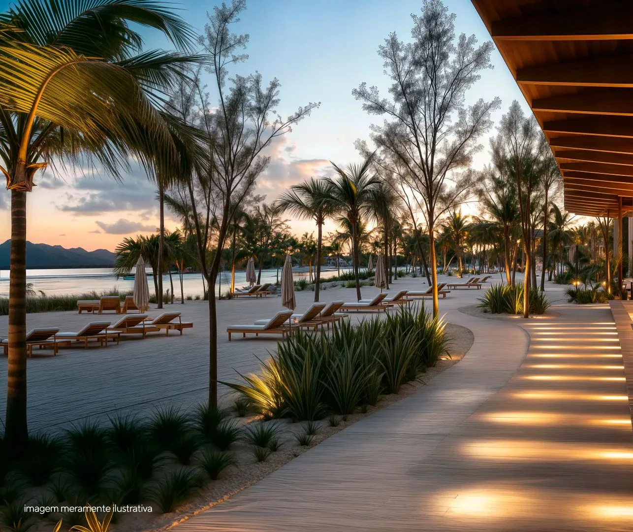 Terraço do resort ao anoitecer com iluminação cênica